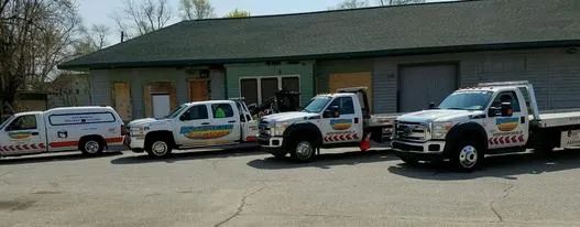 Fleet of Kreager Towing service trucks parked